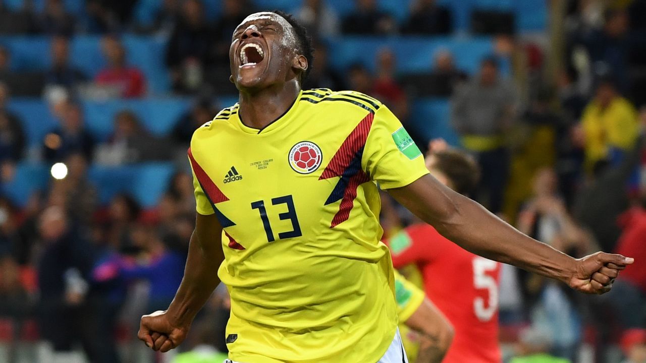 TOPSHOT - Colombia's defender Yerry Mina celebrates after scoring the equalizer during the Russia 2018 World Cup round of 16 football match between Colombia and England at the Spartak Stadium in Moscow on July 3, 2018.