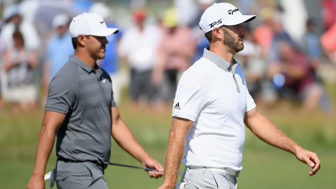 SOUTHAMPTON, NY - JUNE 17: Brooks Koepka of the United States (L) and Dustin Johnson of the United States (R) walk on the eighth green during the final round of the 2018 U.S. Open at Shinnecock Hills Golf Club on June 17, 2018 in Southampton, New York.