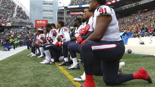 SEATTLE, WA - OCTOBER 29: Members of the Houston Texans kneel during the national anthem before the game against the Seattle Seahawks at CenturyLink Field on October 29, 2017 in Seattle, Washington. During a meeting of NFL owners earlier in October, Houston Texans owner Bob McNair said 'we can't have the inmates running the prison,' referring to player demonstrations during the national anthem.