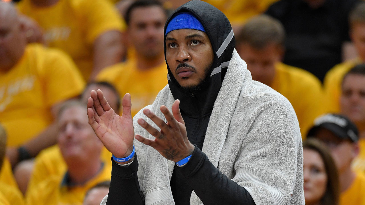 SALT LAKE CITY, UT - APRIL 21: Carmelo Anthony #7 of the Oklahoma City Thunder cheers from the bench in the first half during Game Three of Round One of the 2018 NBA Playoffs against the Utah Jazz at Vivint Smart Home Arena on April 21, 2018 in Salt Lake City, Utah.