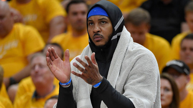 SALT LAKE CITY, UT - APRIL 21: Carmelo Anthony #7 of the Oklahoma City Thunder cheers from the bench in the first half during Game Three of Round One of the 2018 NBA Playoffs against the Utah Jazz at Vivint Smart Home Arena on April 21, 2018 in Salt Lake City, Utah.