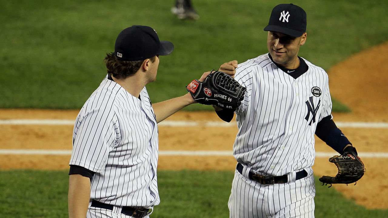 NEW YORK - OCTOBER 09: Phil Hughes #65 (L) and Derek Jeter #2 of the New York Yankees celebrate a play against the Minnesota Twins during Game Three of the ALDS part of the 2010 MLB Playoffs at Yankee Stadium on October 9, 2010 in the Bronx borough of New York City.