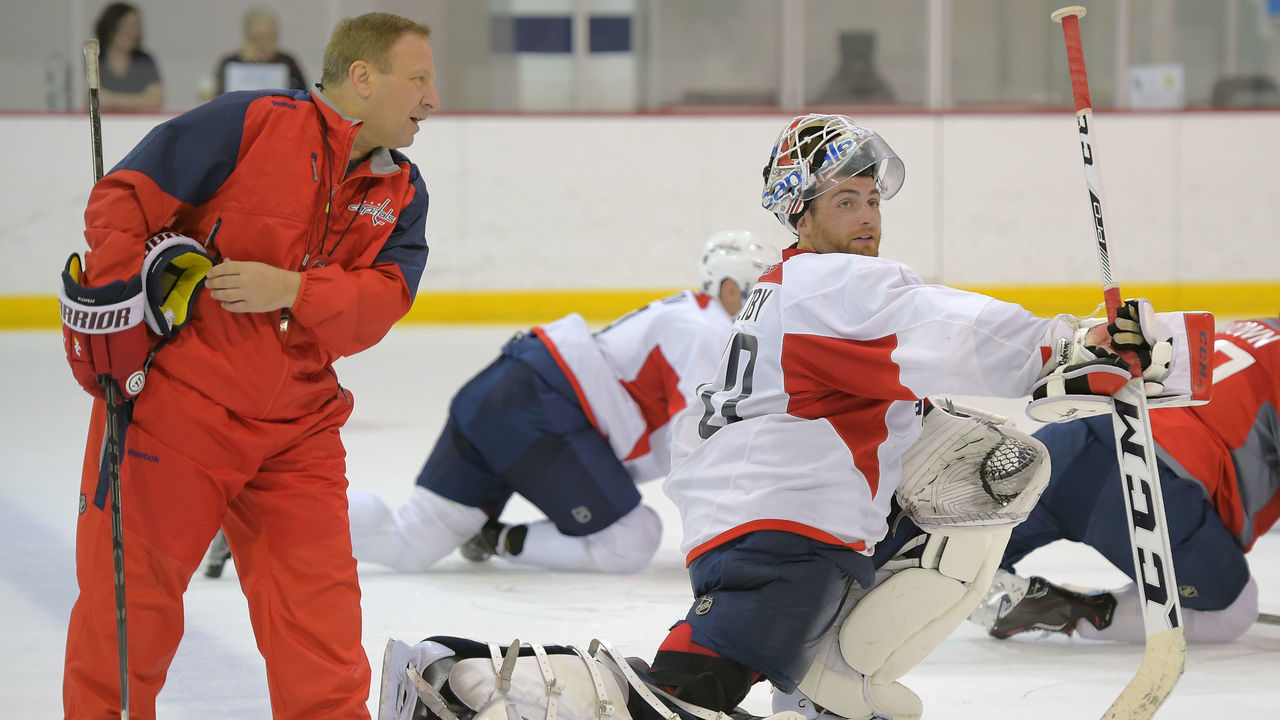 ARLINGTON VA, SEPTEMBER 18: Washington Capitals goalie coach Mitch Korn , left, talks with goalie Braden Holtby during the Washington Capitals training camp in Arlington VA, September 18, 2015.