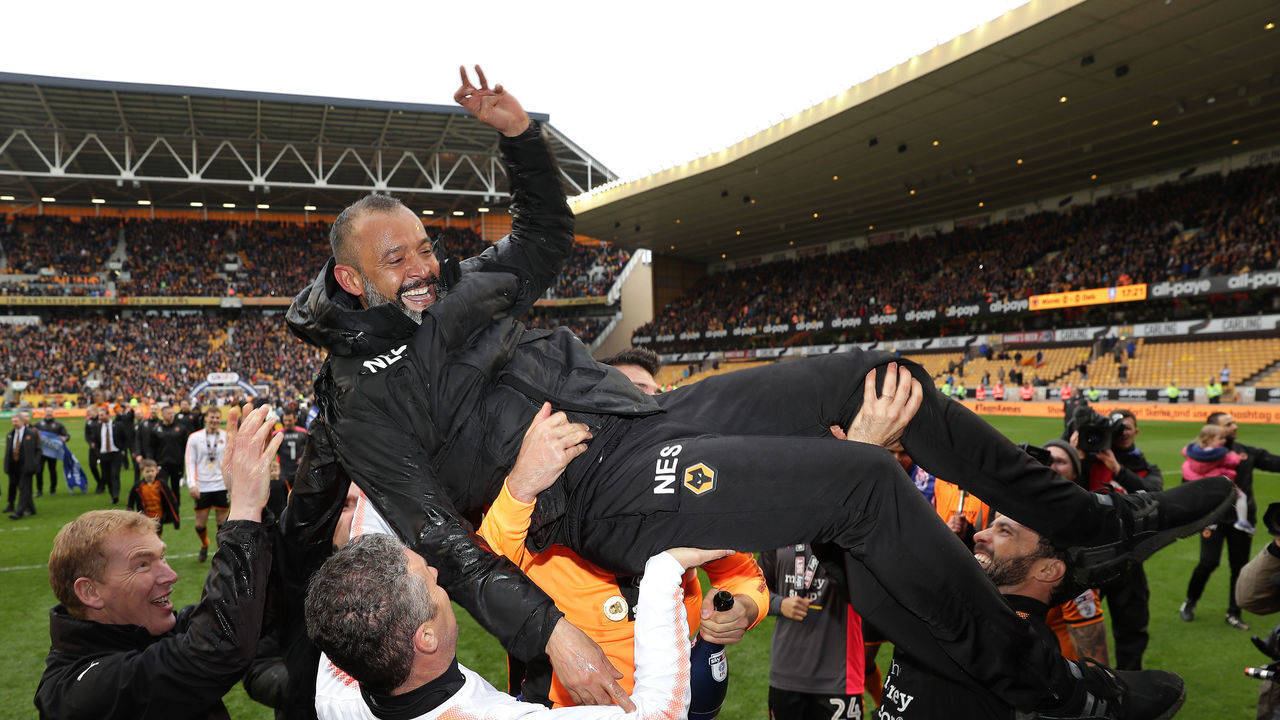 WOLVERHAMPTON, ENGLAND - APRIL 28: Nuno Espirito Santo, Manager of Wolverhampton Wanderers is carried across the pitch after winning the Sky Bet Championship during the Sky Bet Championship match between Wolverhampton Wanderers and Sheffield Wednesday at Molineux on April 28, 2018 in Wolverhampton, England.