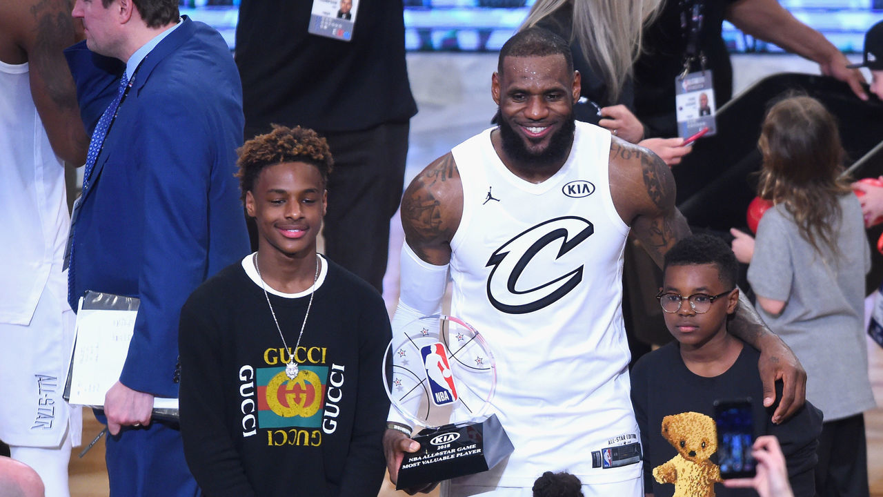LOS ANGELES, CA - FEBRUARY 18: (L-R) LeBron James Jr., LeBron James #23, Zhuri James and Bryce Maximus James pose for a photo with the All-Star Game MVP trophy during the NBA All-Star Game 2018 at Staples Center on February 18, 2018 in Los Angeles, California.