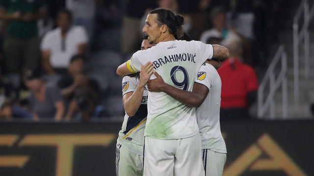 LOS ANGELES, CA - JULY 26: Ola Kamara of LA Galaxy celebrates with his team mates and Zlatan Ibrahimovic after scoring a goal to make it 2-2 during the MLS match between LAFC and LA Galaxy at Banc of California Stadium on July 26, 2018 in Los Angeles, California.