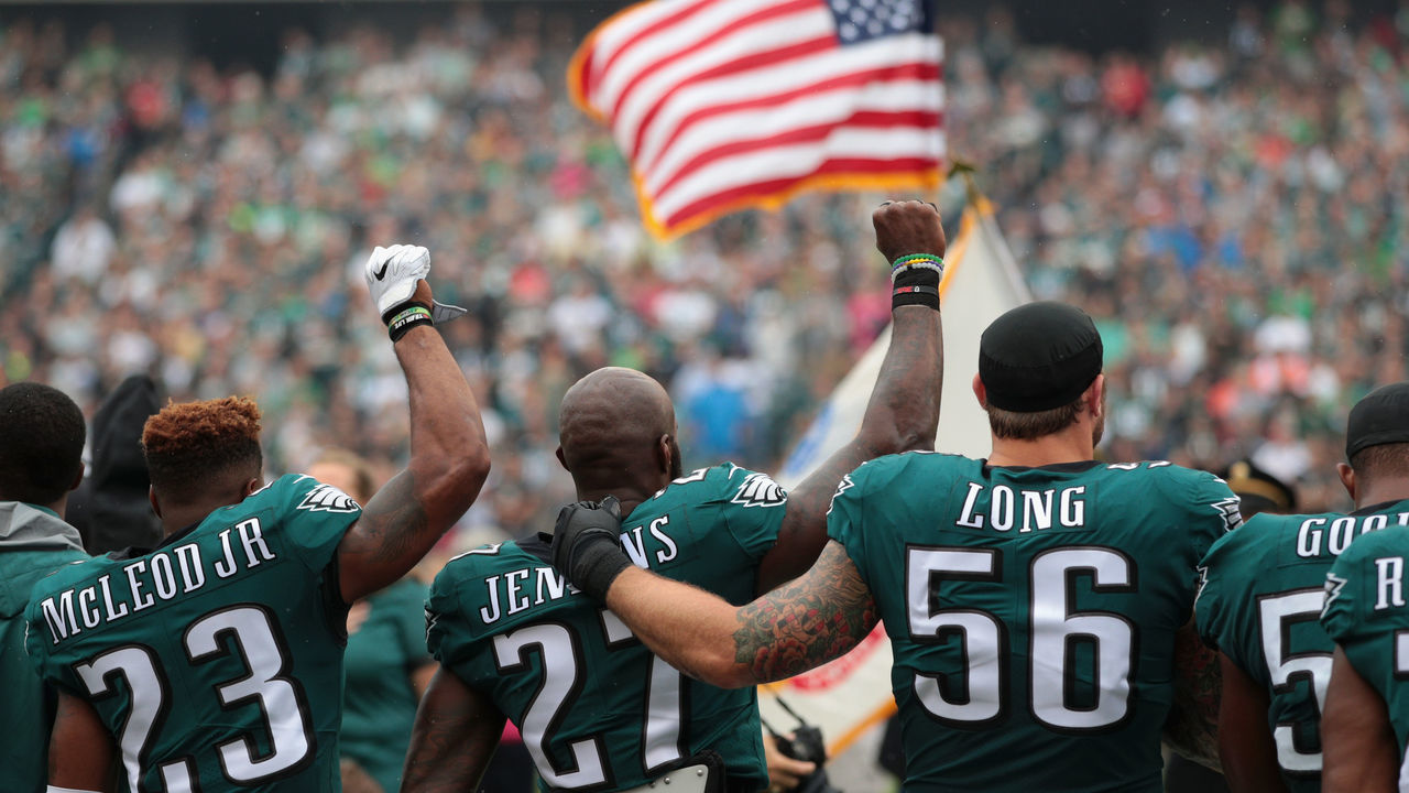 PHILADELPHIA, PA - OCTOBER 08: Rodney McLeod #23, Malcolm Jenkins #27 and Chris Long #56 of the Philadelphia Eagles stand during the National Anthem during the first quarter at Lincoln Financial Field on October 8, 2017 in Philadelphia, Pennsylvania. The Philadelphia Eagles defeated the Arizona Cardinals 34-7.