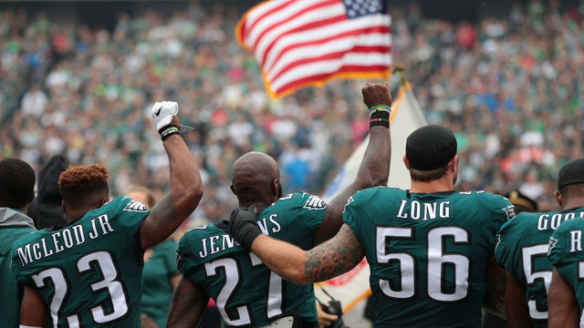 PHILADELPHIA, PA - OCTOBER 08: Rodney McLeod #23, Malcolm Jenkins #27 and Chris Long #56 of the Philadelphia Eagles stand during the National Anthem during the first quarter at Lincoln Financial Field on October 8, 2017 in Philadelphia, Pennsylvania. The Philadelphia Eagles defeated the Arizona Cardinals 34-7.