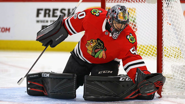 CHICAGO, IL - NOVEMBER 30: Corey Crawford #50 of the Chicago Blackhawks makes a glove save against the Dallas Stars at the United Center on November 30, 2017 in Chicago, Illinois. The Stars defeated the Blackhawks 4-3 in overtime.