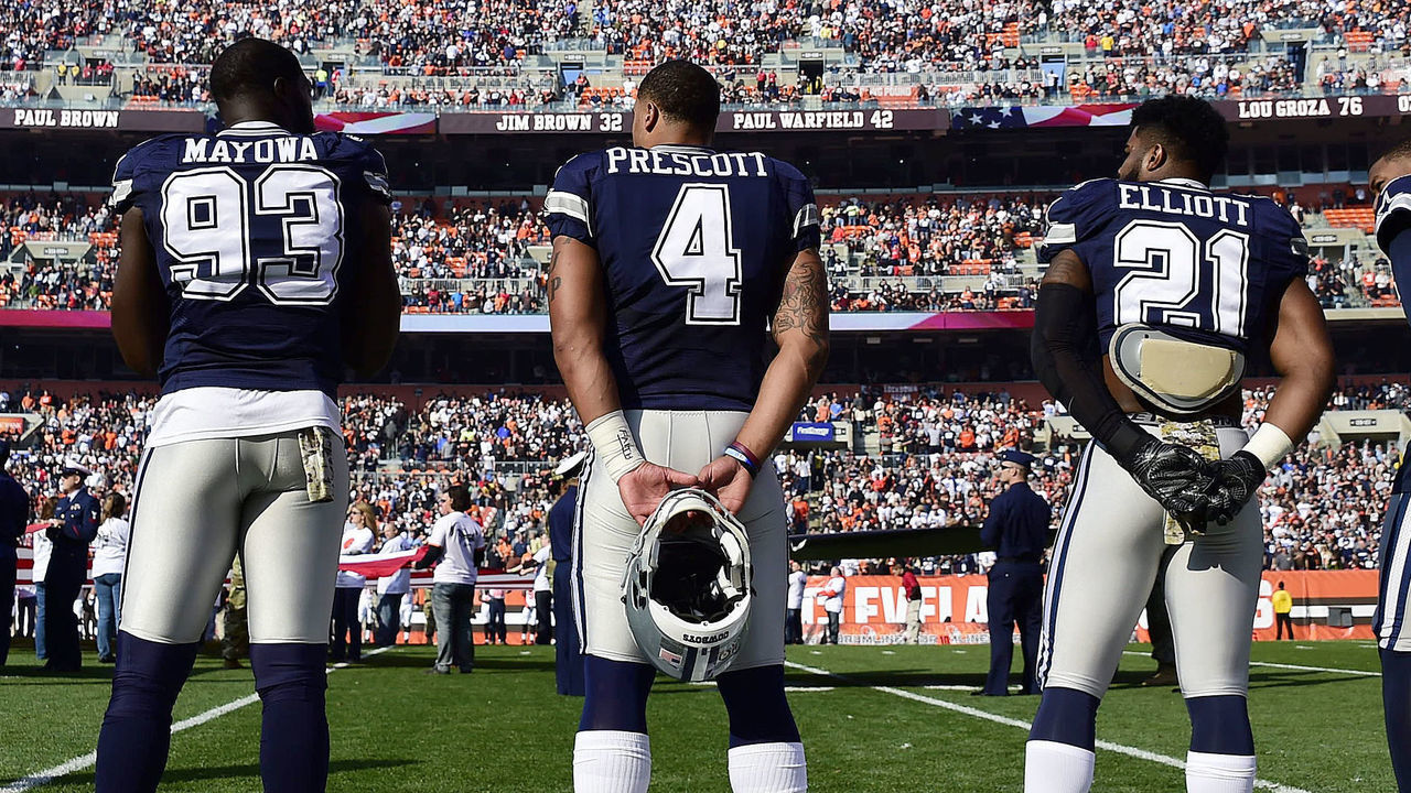 CLEVELAND, OH - NOVEMBER 06: Benson Mayowa #93, Dak Prescott #4, Ezekiel Elliott #21 and Terrance Williams #83 of the Dallas Cowboys stand during the National Anthem at FirstEnergy Stadium on November 6, 2016 in Cleveland, Ohio.