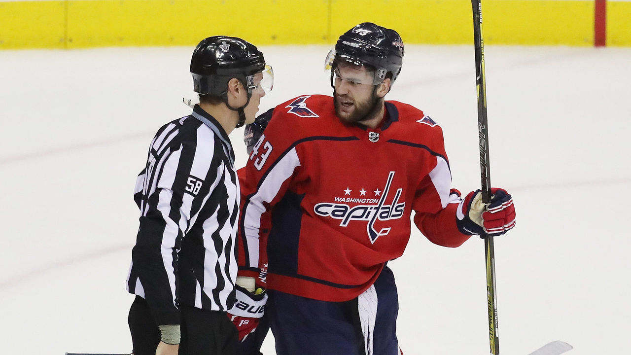 WASHINGTON, DC - MAY 21: linesman Ryan Gibbons #58 escorts Tom Wilson #43 of the Washington Capitals to the bench in the first period of Game Six of the Eastern Conference Finals against the Tampa Bay Lightning during the 2018 NHL Stanley Cup Playoffs at Capital One Arena on May 21, 2018 in Washington, DC.