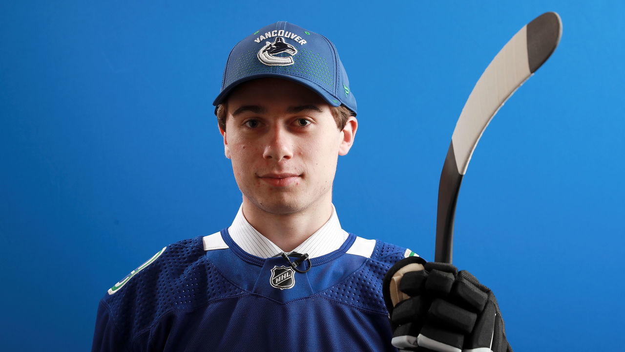 DALLAS, TX - JUNE 22: Quinn Hughes poses after being selected seventh overall by the Vancouver Canucks during the first round of the 2018 NHL Draft at American Airlines Center on June 22, 2018 in Dallas, Texas.