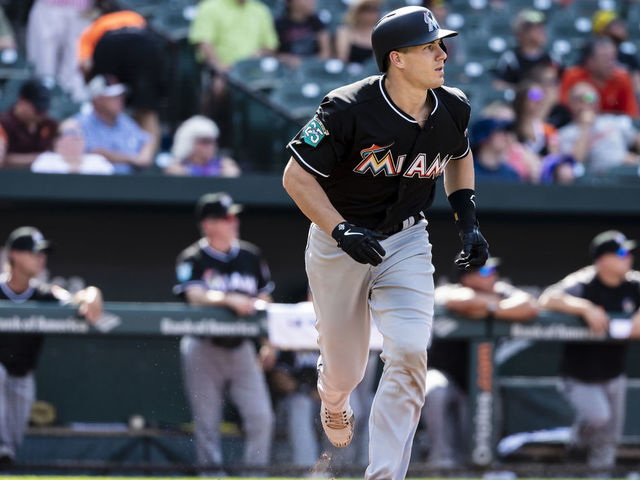 BALTIMORE, MD - JUNE 16: J.T. Realmuto #11 of the Miami Marlins hits a two-run homerun during the third inning at Oriole Park at Camden Yards on June 16, 2018 in Baltimore, Maryland.
