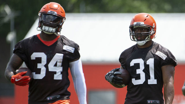 BEREA, OH - JUNE 13, 2018: (L to R) Running backs Carlos Hyde #34, Nick Chubb #31 and Dontrell Hilliard #25 of the Cleveland Browns take part in a drill during a mandatory mini camp on June 13, 2018 at the Cleveland Browns training facility in Berea, Ohio. (Photo by: 2018 Diamond Images/Getty Images)
