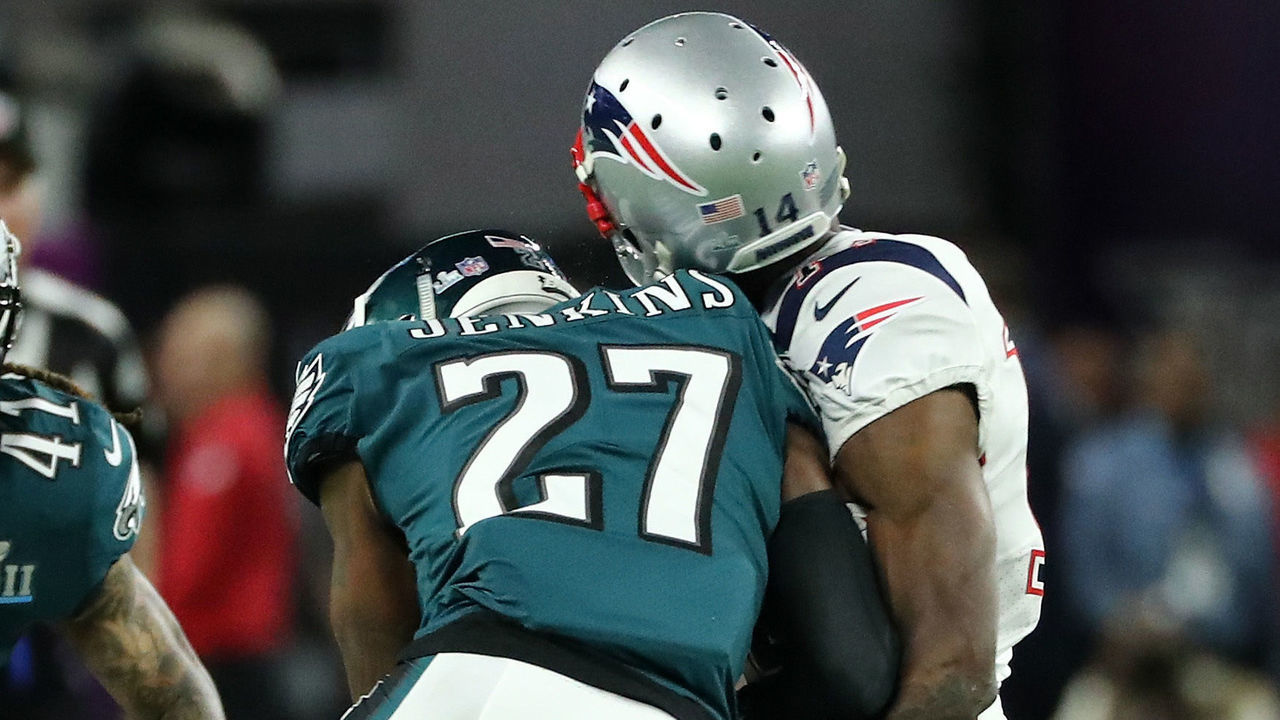 MINNEAPOLIS, MN - FEBRUARY 04: Brandin Cooks #14 of the New England Patriots is tackled by Malcolm Jenkins #27 of the Philadelphia Eagles of the Philadelphia Eagles while attempting a catch in the second quarter of Super Bowl LII at U.S. Bank Stadium on February 4, 2018 in Minneapolis, Minnesota.