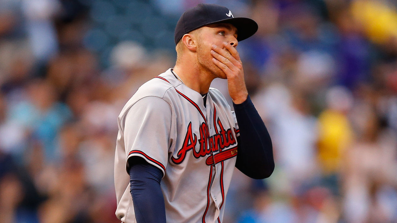 DENVER, CO - AUGUST 15: Starting pitcher Sean Newcomb #51 of the Atlanta Braves reacts after giving up a solo home run during the first inning to Nolan Arenado of the Colorado Rockies at Coors Field on August 15, 2017 in Denver, Colorado.