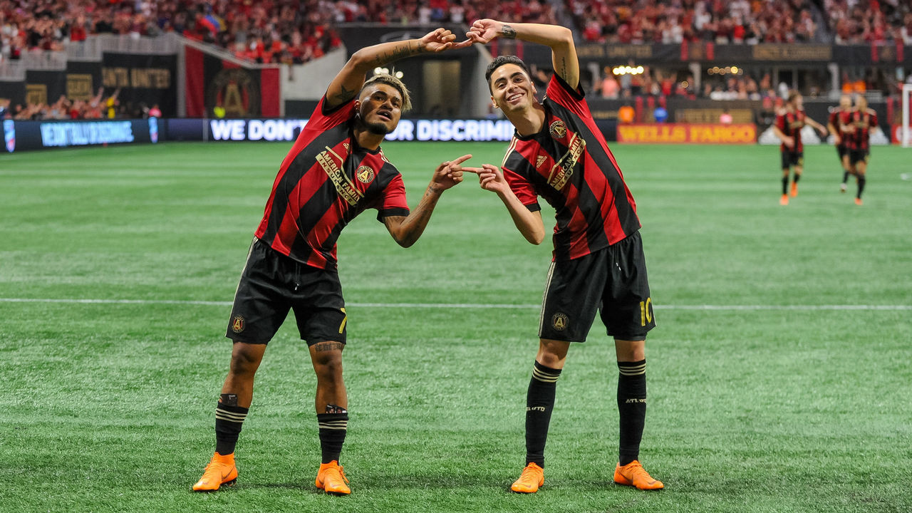 ATLANTA, GA - JUNE 30: Atlanta United midfielder Miguel Almiron (10) and Atlanta United forward Josef Martinez (7) celebrate a goal during an MLS match between the Orlando City and Atlanta United FC on June 30, 2018, at Mercedes-Benz Stadium in Atlanta, GA.