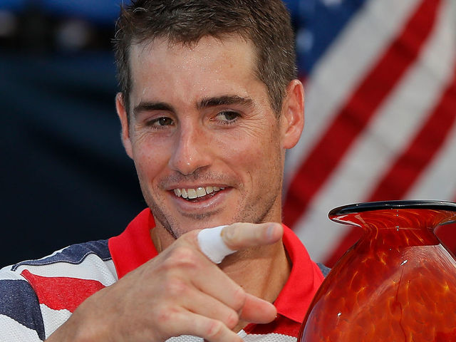 ATLANTA, GA - JULY 29: John Isner poses with the trophy after defeating Ryan Harrison during the BB&T Atlanta Open at Atlantic Station on July 29, 2018 in Atlanta, Georgia.