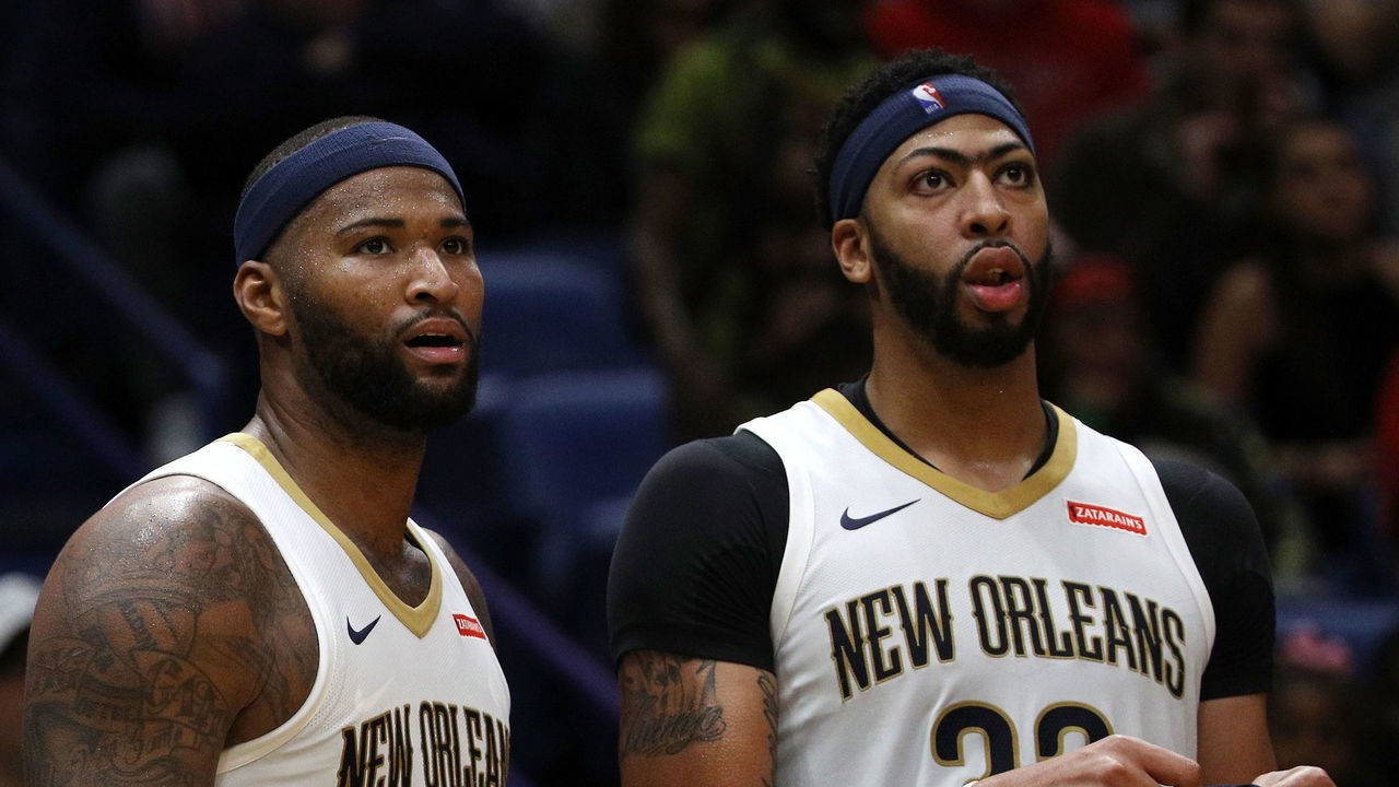 NEW ORLEANS, LA - OCTOBER 28: DeMarcus Cousins #0 and Anthony Davis #23 of the New Orleans Pelicans stand on the bench at the Smoothie King Center on October 28, 2017 in New Orleans, Louisiana.