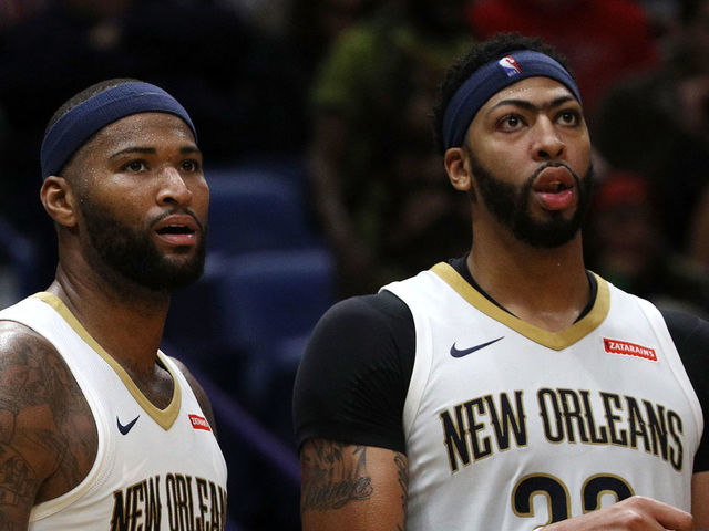 NEW ORLEANS, LA - OCTOBER 28: DeMarcus Cousins #0 and Anthony Davis #23 of the New Orleans Pelicans stand on the bench at the Smoothie King Center on October 28, 2017 in New Orleans, Louisiana.
