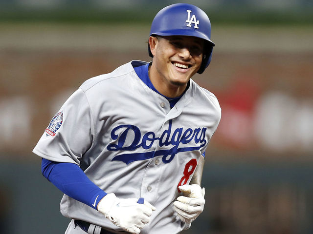 ATLANTA, GA - JULY 26: Third baseman Manny Machado #8 of the Los Angeles Dodgers smiles while running the bases after hitting a solo home run in the sixth inning during the game against the Atlanta Braves at SunTrust Park on July 26, 2018 in Atlanta, Georgia.
