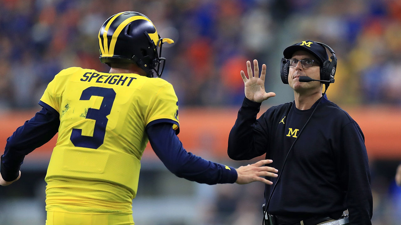 ARLINGTON, TX - SEPTEMBER 02: Wilton Speight #3 of the Michigan Wolverines talks with head coach Jim Harbaugh of the Michigan Wolverines in the first quarter of a game against the Florida Gators at AT&T Stadium on September 2, 2017 in Arlington, Texas.