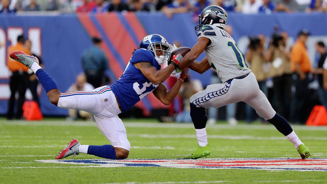 EAST RUTHERFORD, NJ - OCTOBER 22: Ross Cockrell #37 of the New York Giants breaks up a pass against Tyler Lockett #16 of the Seattle Seahawks during the first quarter of the game at MetLife Stadium on October 22, 2017 in East Rutherford, New Jersey.