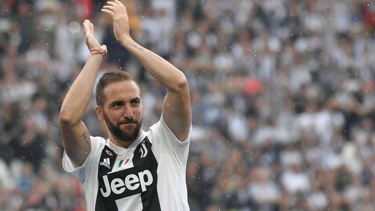 Juventus' forward from Argentina Gonzalo Higuain applauds fans during the trophy ceremony following the Italian Serie A last football match of the season Juventus versus Verona, on May 19, 2018 at the Allianz Stadium in Turin. Juventus won their 34th Serie A title (scudetto) and seventh in succession.