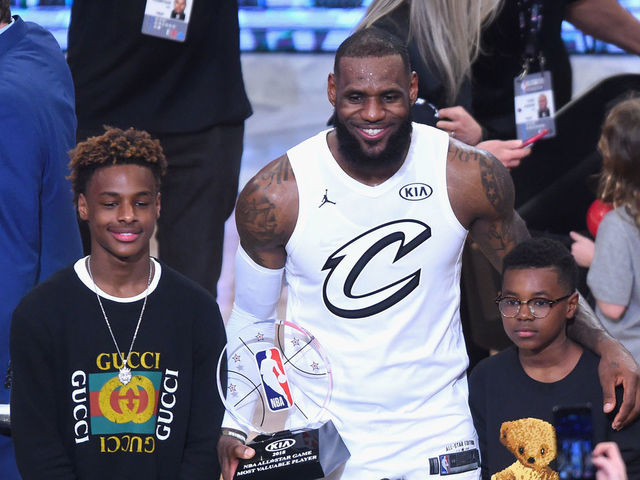 LOS ANGELES, CA - FEBRUARY 18: (L-R) LeBron James Jr., LeBron James #23, Zhuri James and Bryce Maximus James pose for a photo with the All-Star Game MVP trophy during the NBA All-Star Game 2018 at Staples Center on February 18, 2018 in Los Angeles, California.