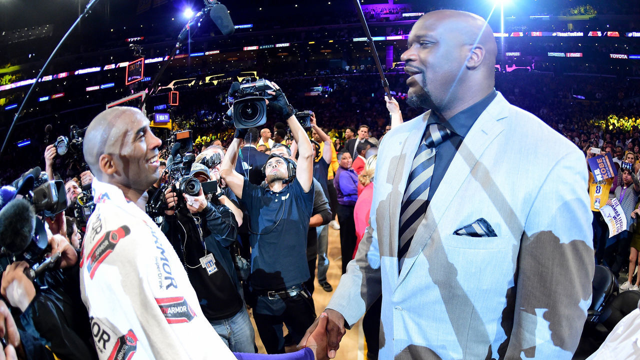 LOS ANGELES, CA - APRIL 13: Kobe Bryant #24 of the Los Angeles Lakers talks with former teammate Shaquille O'Neal after scoring 60 points in his final NBA game at Staples Center on April 13, 2016 in Los Angeles, California. The Lakers defeated the Utah Jazz 101-96.