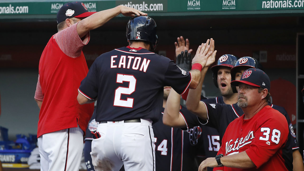 WASHINGTON, DC - JULY 20: Adam Eaton #2 of the Washington Nationals celebrates with his teammates after stealing home in the first inning against the Atlanta Braves at Nationals Park on July 20, 2018 in Washington, DC.