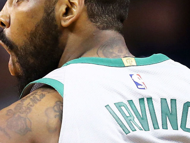 BOSTON, MA - FEBRUARY 11: Kyrie Irving #11 of the Boston Celtics reacts during a game against the Cleveland Cavaliers at TD Garden on February 11, 2018 in Boston, Massachusetts.
