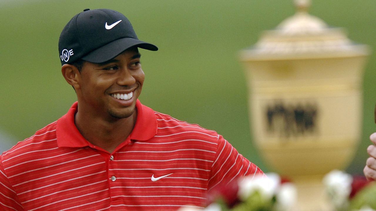 AKRON, OH - AUGUST 27: Tiger Woods smiles at the crowd after winning the Bridgestone Invitational at Firestone Country Club August 27, 2006 in Akron, Ohio.