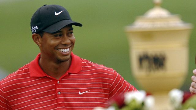 AKRON, OH - AUGUST 27: Tiger Woods smiles at the crowd after winning the Bridgestone Invitational at Firestone Country Club August 27, 2006 in Akron, Ohio.