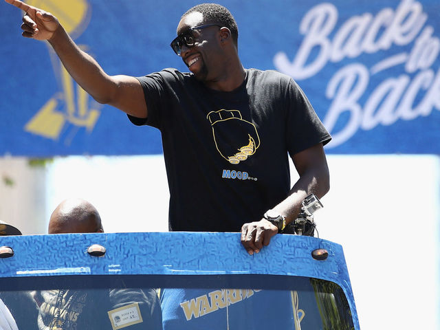 OAKLAND, CA - JUNE 12: Draymond Green #23 of the Golden State Warriors gestures to the crowd during the Golden State Warriors Victory Parade on June 12, 2018 in Oakland, California. The Golden State Warriors beat the Cleveland Cavaliers 4-0 to win the 2018 NBA Finals.