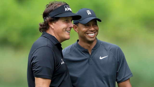 AKRON, OH - AUGUST 01: Phil Mickelson (L) and Tiger Woods smile during a practice round prior to the World Golf Championships-Bridgestone Invitational at Firestone Country Club South Course on August 1, 2018 in Akron, Ohio.