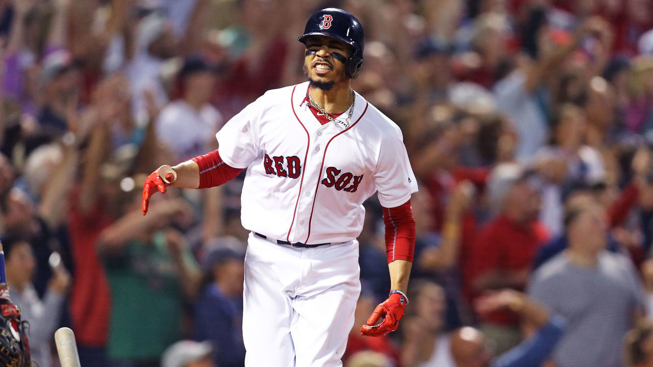 BOSTON, MA - JULY 12: Mookie Betts #50 of the Boston Red Sox celebrates after hitting a grand slam against the Toronto Blue Jays during the fourth inning at Fenway Park on July 12, 2018 in Boston, Massachusetts.