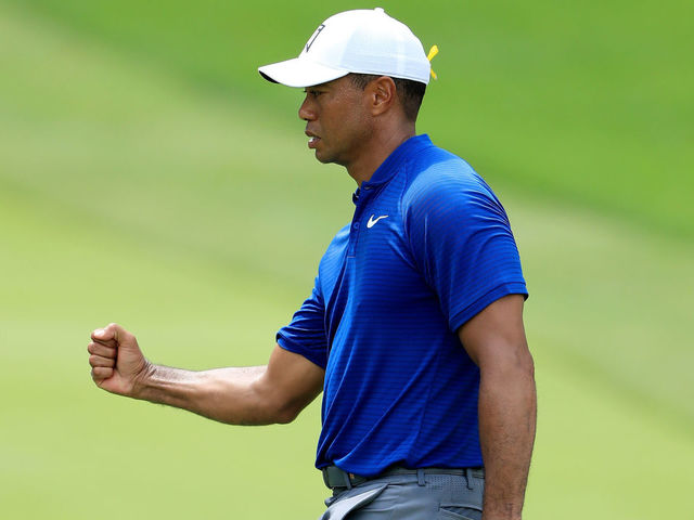 AKRON, OH - AUGUST 02: Tiger Woods reacts after making birdie on the 18th green during World Golf Championships-Bridgestone Invitational - Round One at Firestone Country Club South Course on August 2, 2018 in Akron, Ohio.