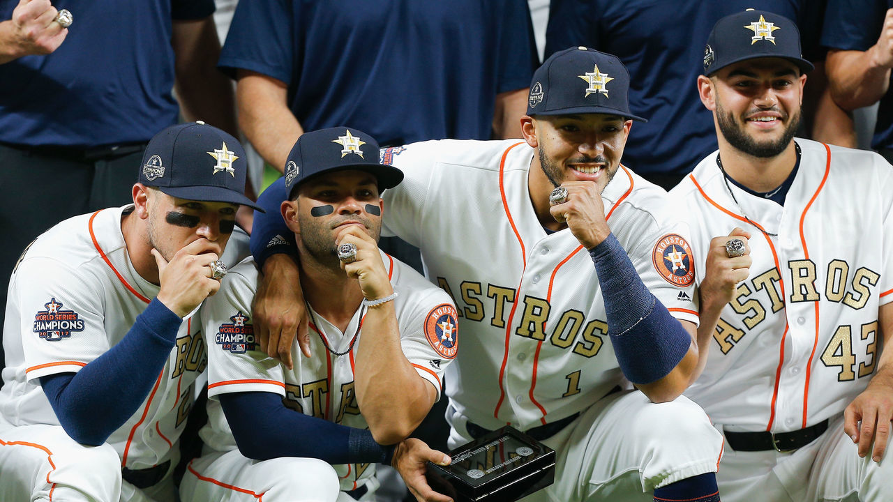 HOUSTON, TX - APRIL 03: (L-R) Alex Bregman #2 of the Houston Astros, Jose Altuve #27, Carlos Correa #1 and Lance McCullers Jr. #43 pose with their world series championship rings at Minute Maid Park on April 3, 2018 in Houston, Texas.