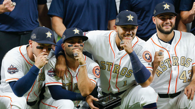 HOUSTON, TX - APRIL 03: (L-R) Alex Bregman #2 of the Houston Astros, Jose Altuve #27, Carlos Correa #1 and Lance McCullers Jr. #43 pose with their world series championship rings at Minute Maid Park on April 3, 2018 in Houston, Texas.