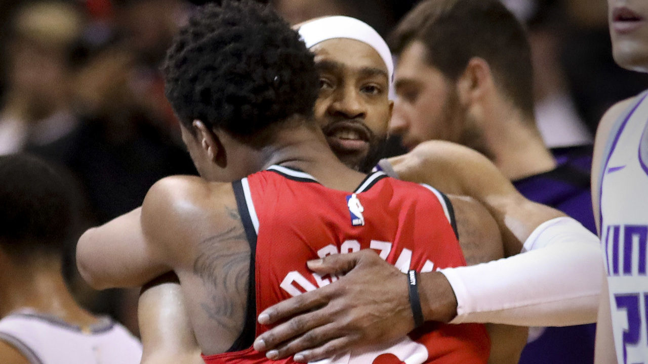 TORONTO, ON - DECEMBER, 17 At the end of the game, Sacramento Kings guard Vince Carter (15) gives Toronto Raptors guard DeMar DeRozan (10) a hug. The Toronto Raptors beat the Sacramento Kings 108-93 at the Air Canada Centre in Toronto. This could be the last game that former Raptor star Vince Carter plays in Toronto. ACC, NBA, sport, basketball, sport, ball, hoop December, 17 2017 (Richard Lautens/Toronto Star via Getty Images)