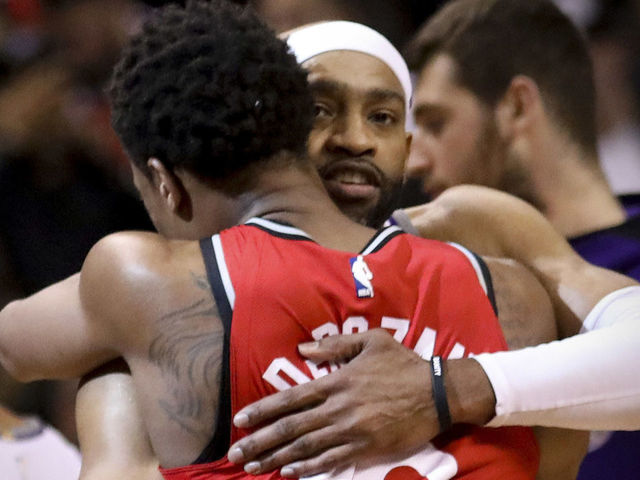 TORONTO, ON - DECEMBER, 17 At the end of the game, Sacramento Kings guard Vince Carter (15) gives Toronto Raptors guard DeMar DeRozan (10) a hug. The Toronto Raptors beat the Sacramento Kings 108-93 at the Air Canada Centre in Toronto. This could be the last game that former Raptor star Vince Carter plays in Toronto. ACC, NBA, sport, basketball, sport, ball, hoop December, 17 2017 (Richard Lautens/Toronto Star via Getty Images)
