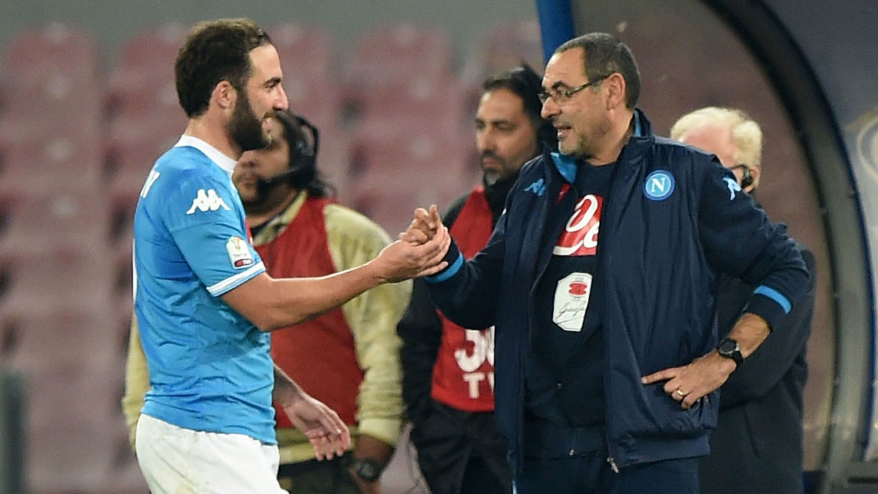 NAPLES, ITALY - DECEMBER 16: Napoli's coach Maurizio Sarri greets coach player Gonzalo Higuain during the TIM Cup match between SSC Napoli and Hellas Verona FC at Stadio San Paolo on December 16, 2015 in Naples, Italy.