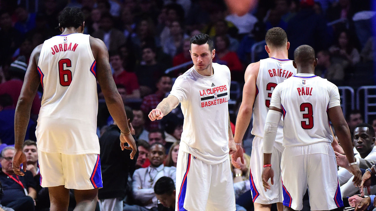 LOS ANGELES, CA - DECEMBER 07: J.J. Redick #4 of the LA Clippers greets Blake Griffin #32, Chris Paul #3 and DeAndre Jordan #6 as they leave the game during a 115-98 Golden State Warriors win at Staples Center on December 7, 2016 in Los Angeles, California.