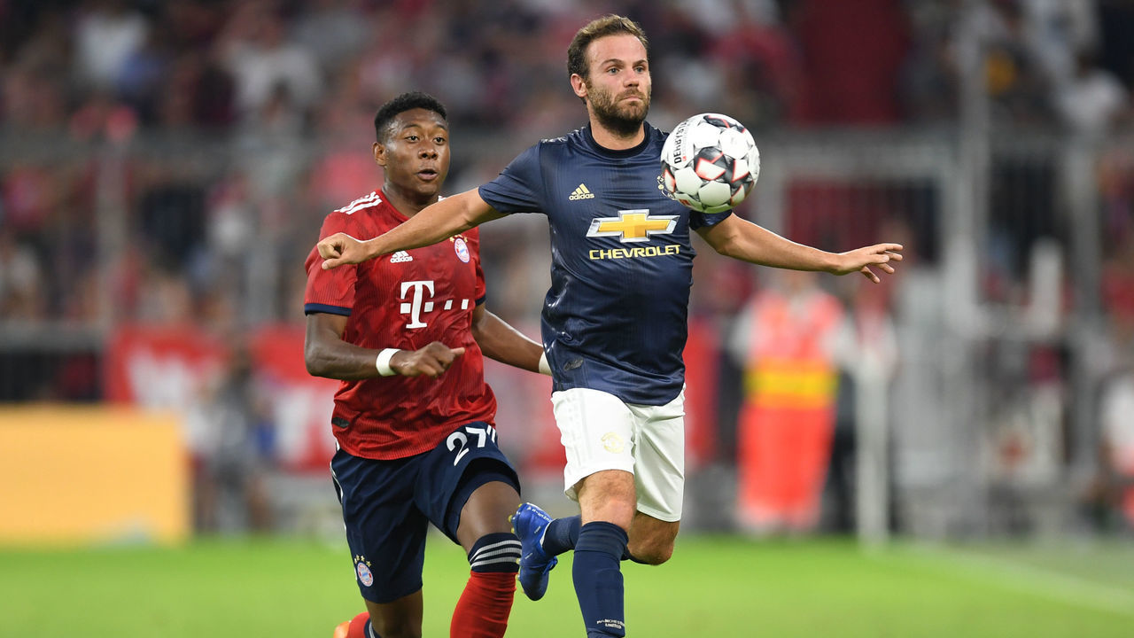 Bayern Munich's Austrian defender David Alaba (L) vies with Manchester's Spanish midfielder Juan Mata (R) uring a friendly football match between FC Bayern Munich and Manchester United in Munich, southern Germany, on August 5, 2018.
