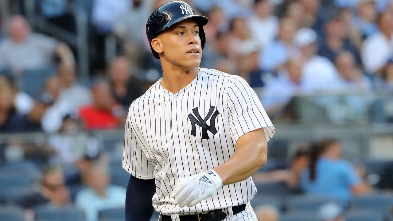 NEW YORK, NY - JULY 26: Aaron Judge #99 of the New York Yankees heads to the dugout after he scored in the first inning against the Kansas City Royals at Yankee Stadium on July 26, 2018 in the Bronx borough of New York City.