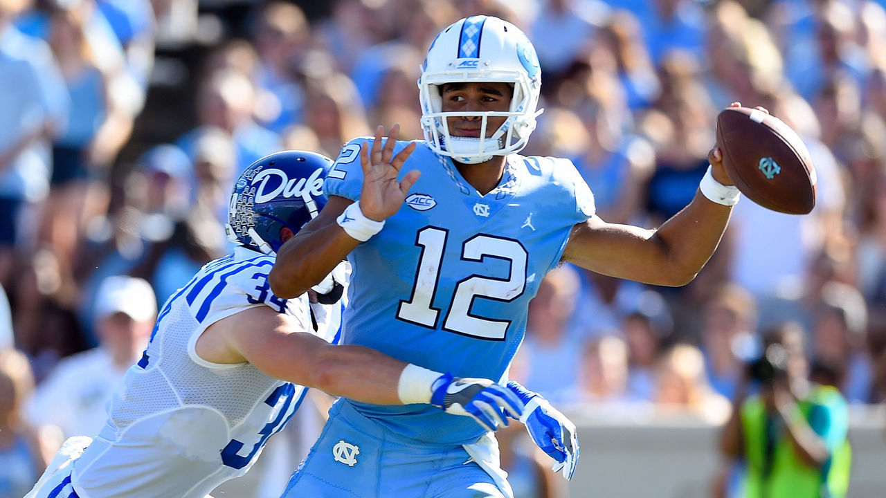 CHAPEL HILL, NC - SEPTEMBER 23: Ben Humphreys #34 of the Duke Blue Devils pressures Chazz Surratt #12 of the North Carolina Tar Heels during their game at Kenan Stadium on September 23, 2017 in Chapel Hill, North Carolina.