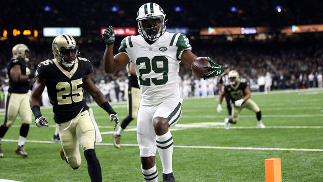 NEW ORLEANS, LA - DECEMBER 17: Bilal Powell #29 of the New York Jets scores a touchdown as Rafael Bush #25 of the New Orleans Saints defends during the first half of a game at the Mercedes-Benz Superdome on December 17, 2017 in New Orleans, Louisiana.