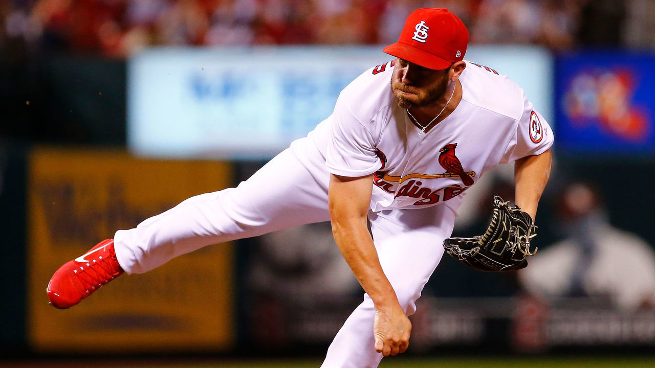 ST. LOUIS, MO - JUNE 29: Greg Holland #56 of the St. Louis Cardinals delivers a pitch against the Atlanta Braves in the eighth inning at Busch Stadium on June 29, 2018 in St. Louis, Missouri.