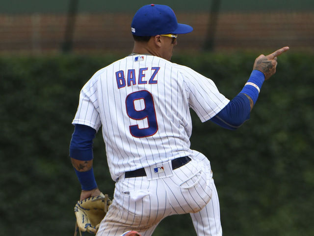 CHICAGO, IL - JULY 21: Javier Baez #9 of the Chicago Cubs reacts after making a play during the ninth inning against the St. Louis Cardinals during game one of a doubleheader on July 21, 2018 at Wrigley Field in Chicago, Illinois. The Cubs won 7-2.